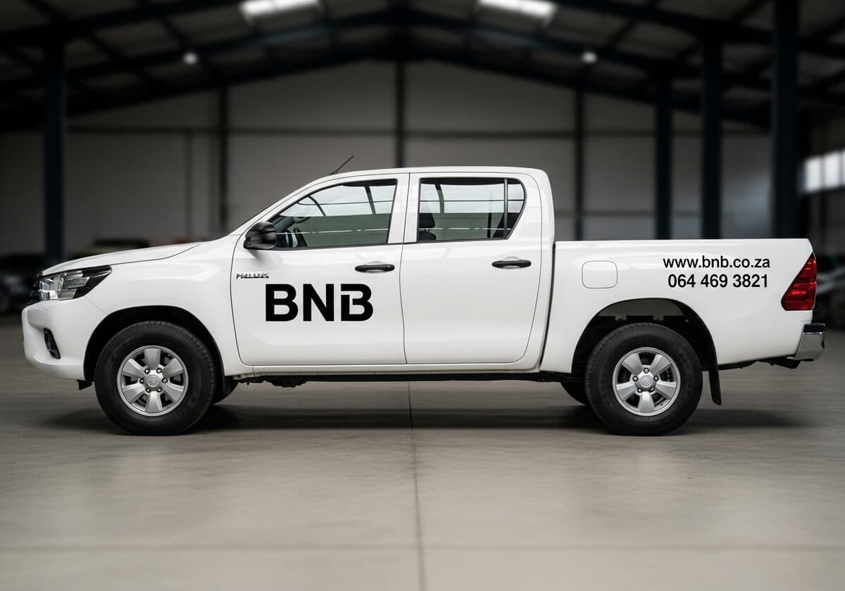 Professionally branded white Hilux bakkie with BNB decals